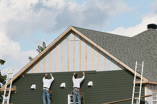 Professional Siding Installation technician working in Monroe, GA